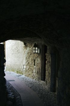 Little tunnel in the narrow street of medieval town
