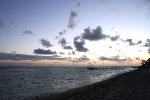 Beautiful romantic sunset on the lonely beach in Mauritius