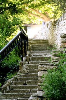 Stoned stair with ferric railing in the garden