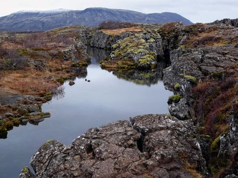 Thingvellir, a fissure in the earth�s crust where the european and american continents slowly drift apart. It�s also the place where the first Icelandic parliament seated.