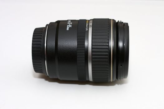 black generic zoom lens with caps on to keep out the dust