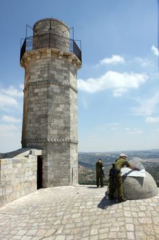 Israely soldiers with maps at a sunny day