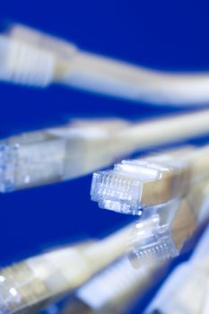 white utp cat5 network cables blue background