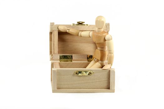 A Wooden manikin in treasure chest