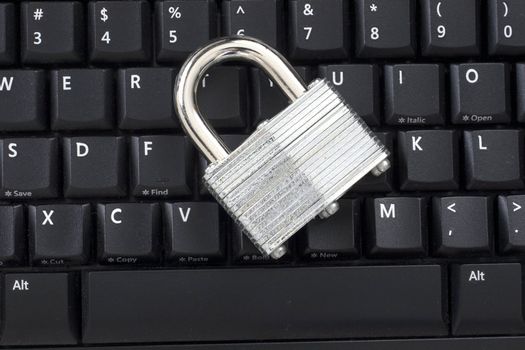 A Locked padlock on a keyboard representing Information Security