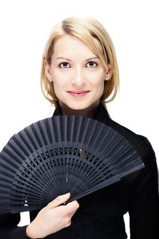 Portrait of a successful,  elegant, atractive, business woman wearing black blouse holding folding fan.