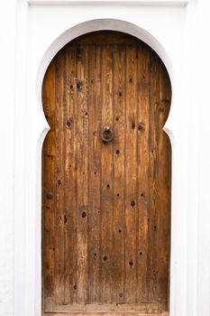 Traditional moorish style wooden door in a white background
