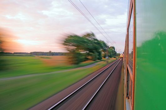 Fast riding a train with motion blur