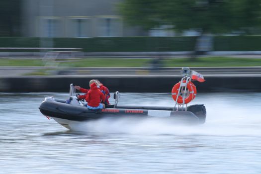 Rescue boat riding at high speed wit motion blur
