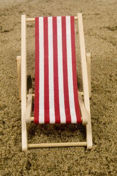 red beach chair on sand