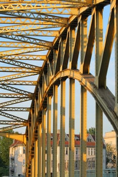 Girder of an old yellow steel bridge
