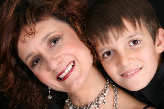 Rich and stylish mother and son in formal attire