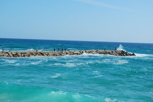 local fishermans in action by the ocean 