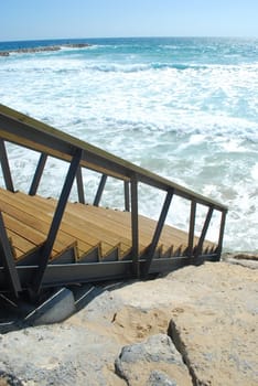 beautiful scene with stairs entering the ocean