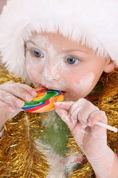 Christmas toddler got a lollipop reward for baking cookies