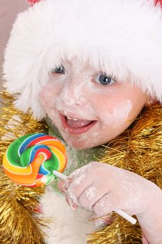 Christmas toddler got a lollipop reward for baking cookies