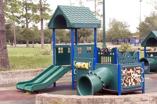 A playground shaped as a house with slides
