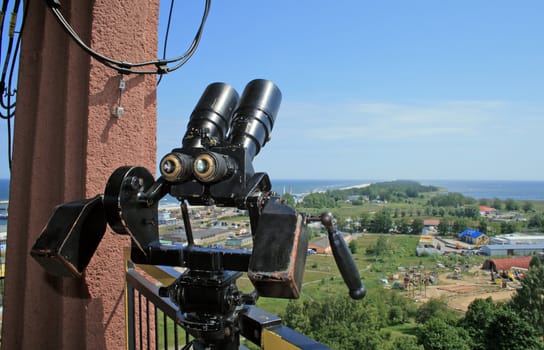 Binoculars and the aerial view of the "helski" peninsula, tombolo at Wladyslawowo, Poland
