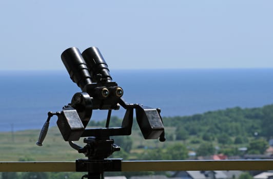Binoculars and the aerial view of the "helski" peninsula, tombolo at Wladyslawowo, Poland

