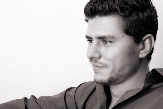 Male model in studio against white wall