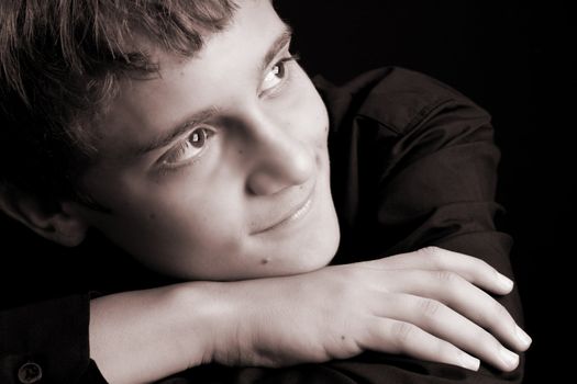 Teenage male in casual attire looking into the distance