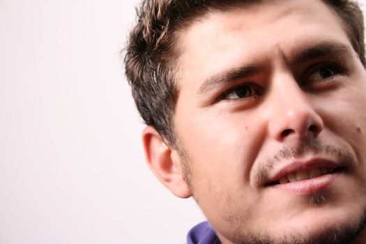 Male model in studio against white wall