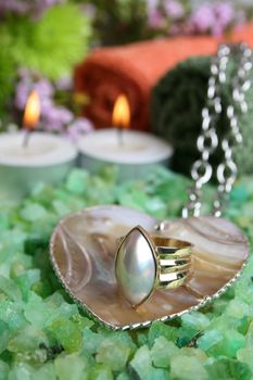 Spa Accessories setting with face cloths, candles jewelery