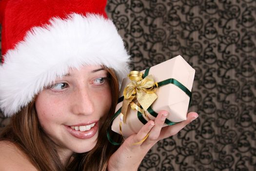 Brunette Teenager wearing a fluffy christmas hat