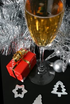 Small christmas gift amongst a variety of decorations