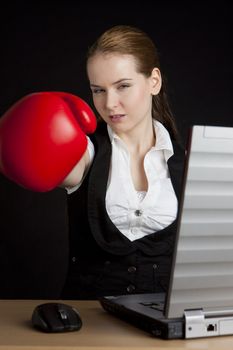 businesswoman with a notebook and boxing glove