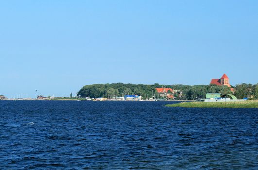 Turquoise water, marina and an old castle at the baltic sea, Poland
