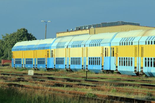 Railway double deck cars standing at the railway depot
