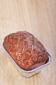 baked bavarian meat loaf on a wooden desk