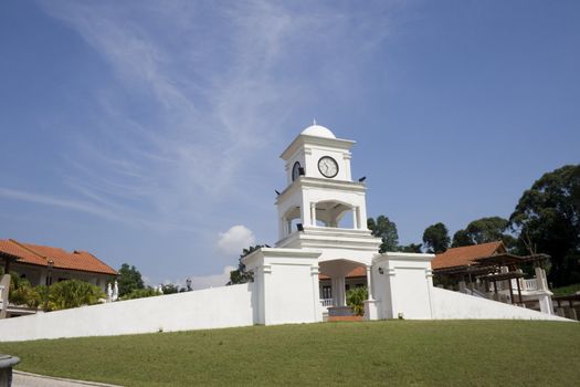 A clock tower in a park locate in Johor, Malaysia.