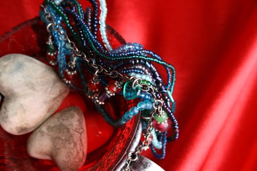 Valetines day hearts in a bowl with jewelery