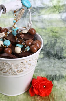 Bucket filled with sweets and blue beading