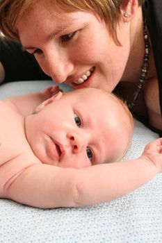 Loving mother with her new baby boy