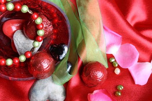 Valetines day hearts in a bowl with jewelery