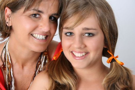 Beautiful mother and daughter on a white background