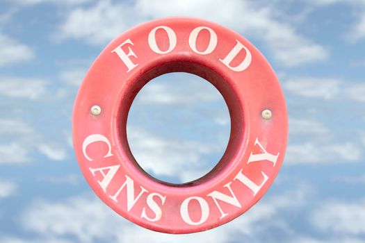 a bin sign for recycling food cans only with cloudy background