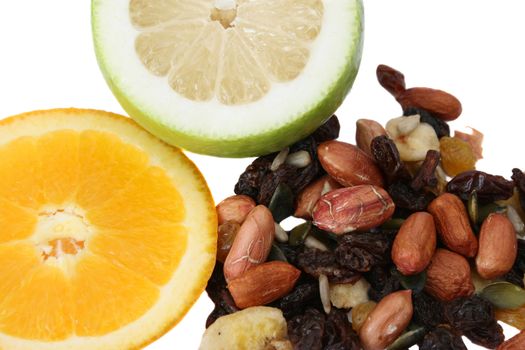 Sliced orange, lime and variety of nuts 