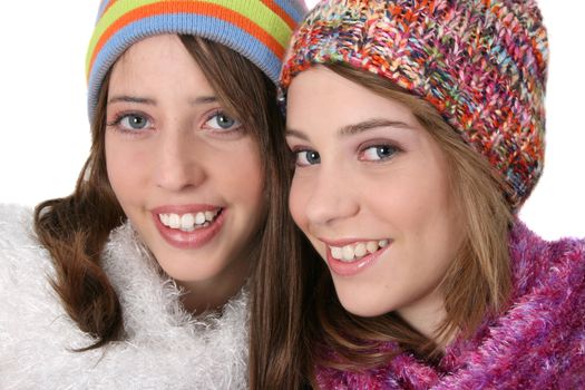 Beautiful teenage female friends in winter clothing