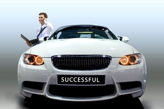 Young businessman by modern white car