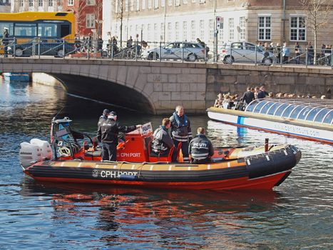 COPENHAGEN - APR 14: Unknown Danish Policemen escort European Royal guests to the reception after the christening of Prince Vincent and Princess Josephine on April 14, 2011, Copenhagen, Denmark.