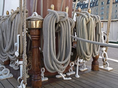 old and used ships sail ropes hanging on deck