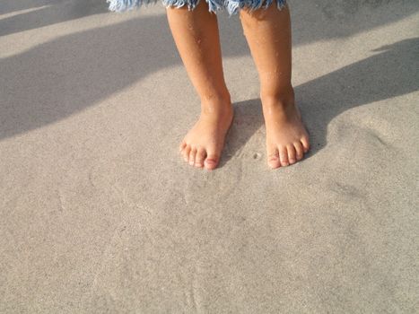 small feets in the sand