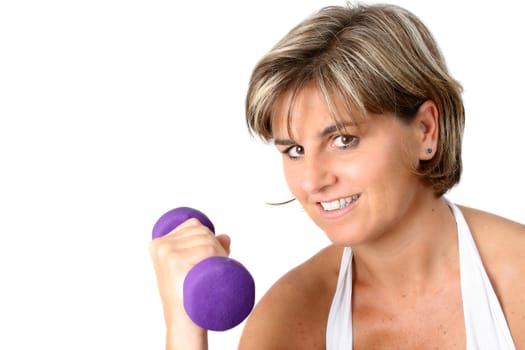 Friendly mature female exercising with small weights