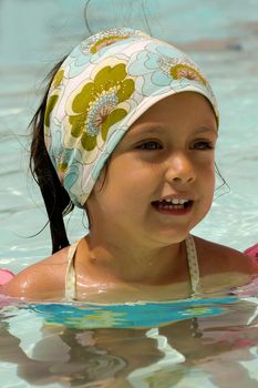 Happy child in a swimming pool