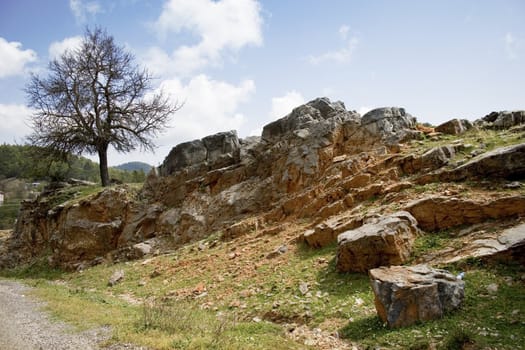 Stone's wall at road with blue sky