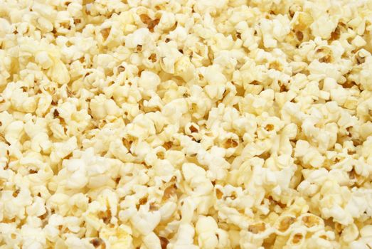 A macro shot of popcorn that is filling the frame.